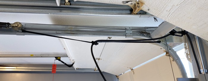 Rubber-tarp-tie-down-with-bungees-for-charging-cable