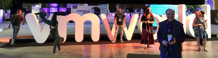 Attendee-doing-hand-stand-at-VMworld-2018-US-in-front-of-VMworld-sign-by-Paul-Braren-on-2018-08-28-at-ITProHobby.JPG
